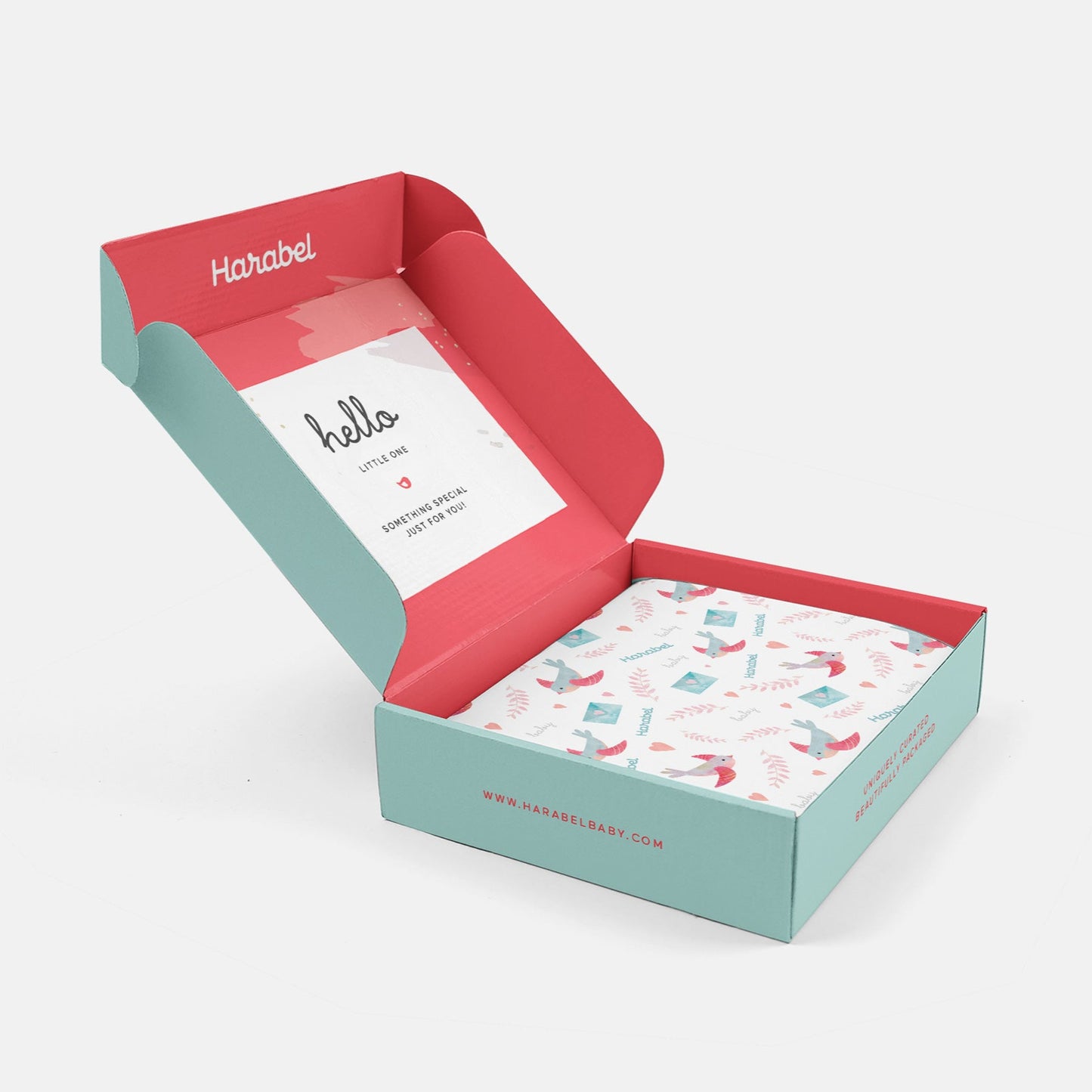Open box with a card and patterned paper inside, branded 'Harabel'.