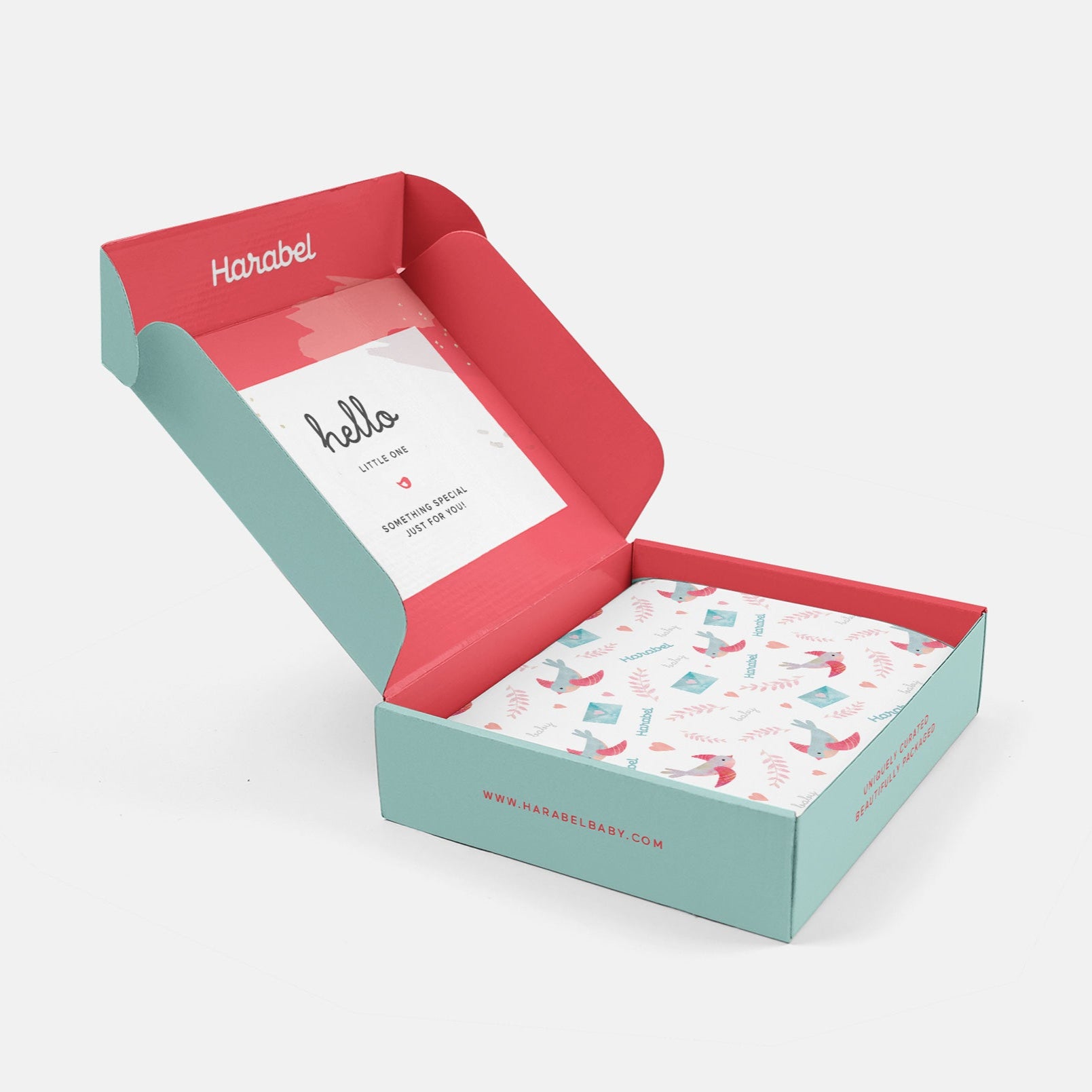 Open box with a card and patterned paper inside, branded 'Harabel'.